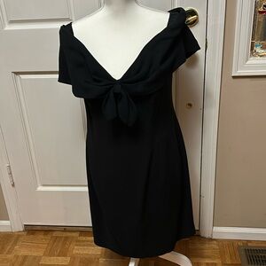 Black off the shoulder cocktail dress.